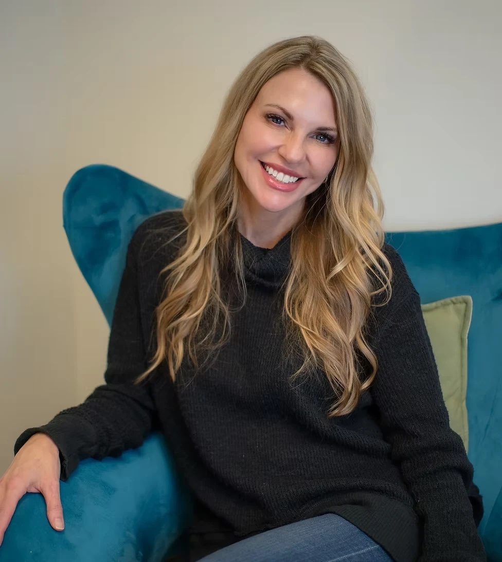 Suzanne Davis, seated and smiling
